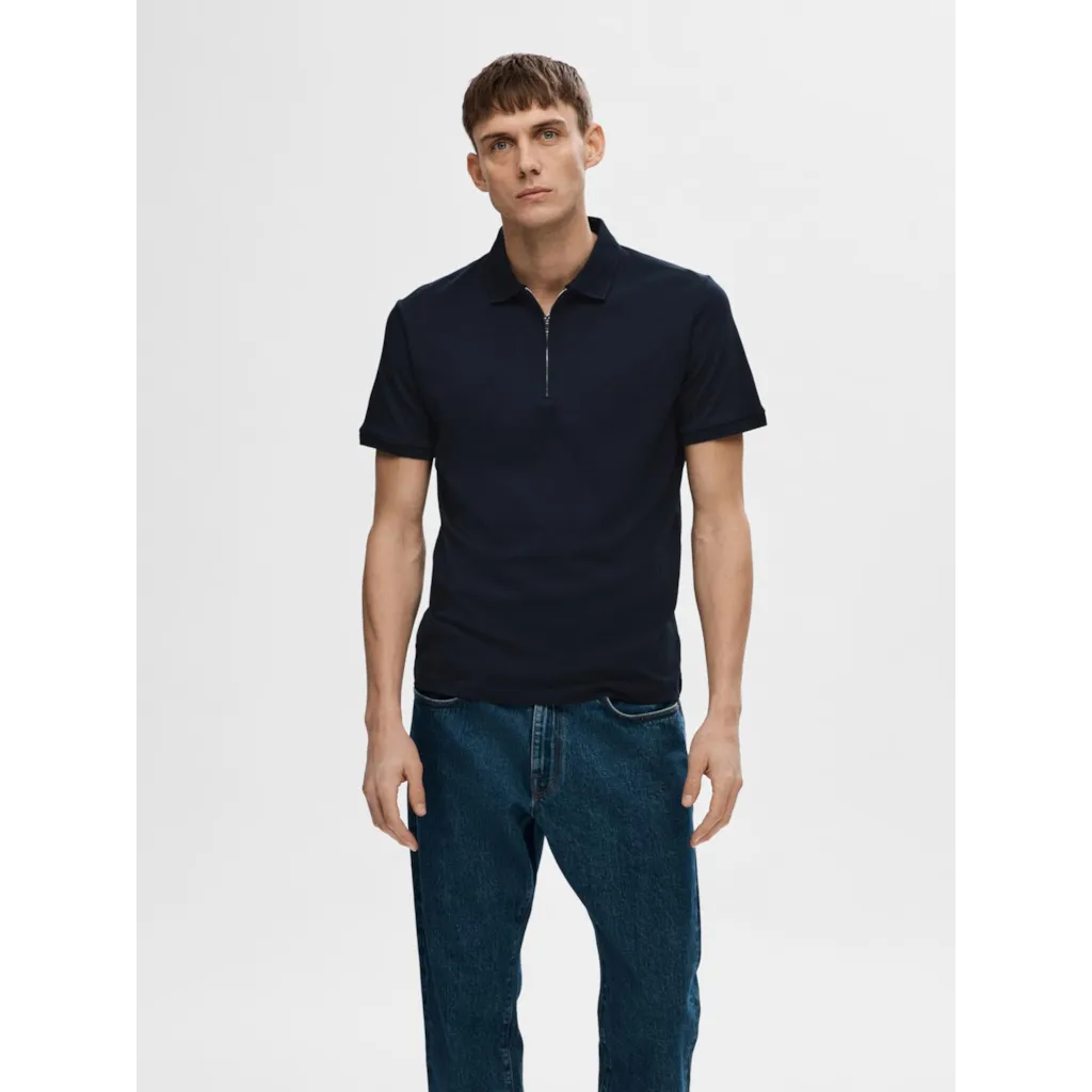 Polo shirt with half zip- Made of organic cotton and recycled polyester- Interlock fabric is a little thicker and smoother- Regular fit- Ribbed collar and cuffs- Mercerized for durability and a silk-like luster