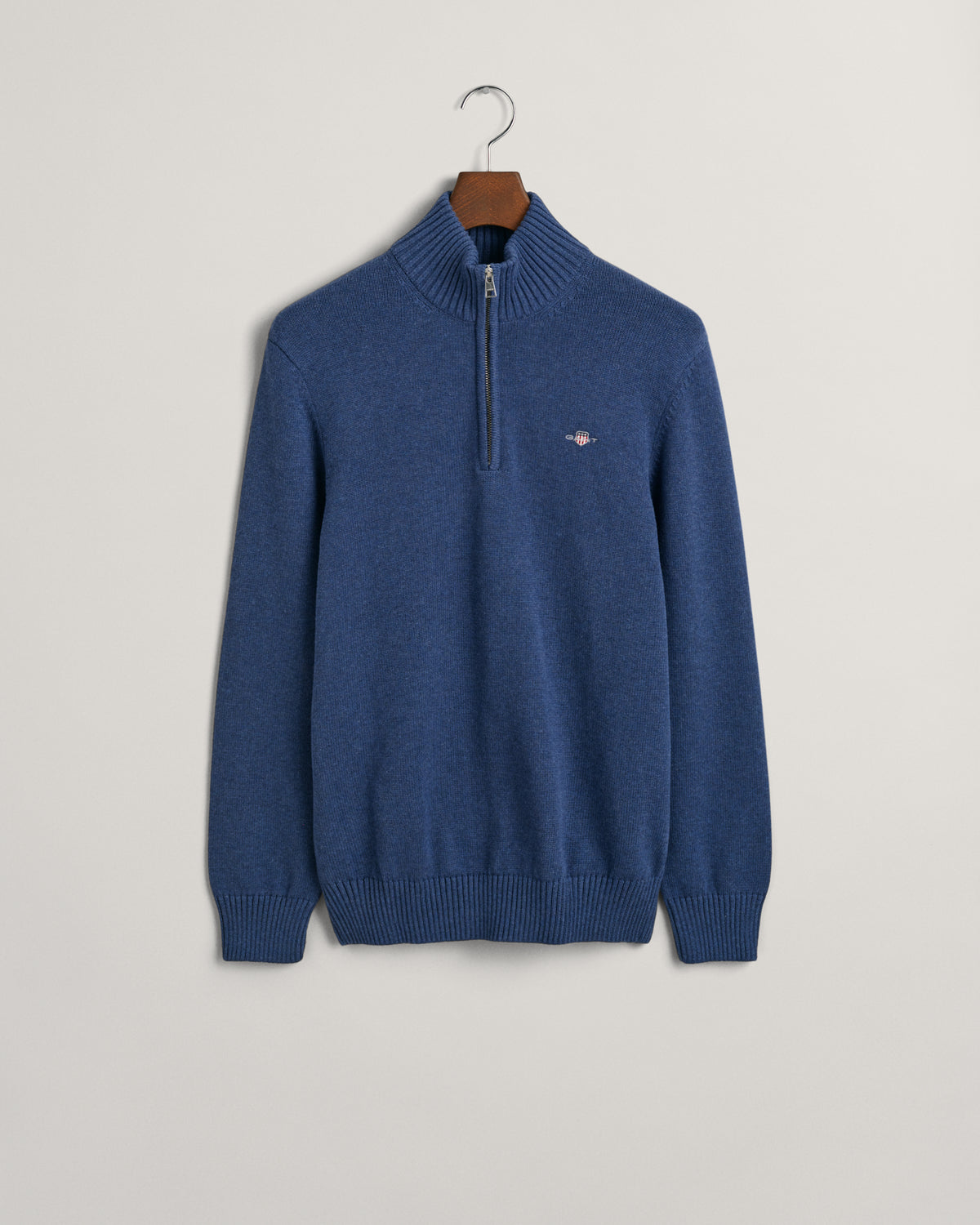 Crafted in medium-weight cotton and cut in a regular fit, this half-zip sweater features a GANT shield graphic embroidered at the chest. A perfect layer for style and warmth, pair this sweater with denim and tailored pants alike.