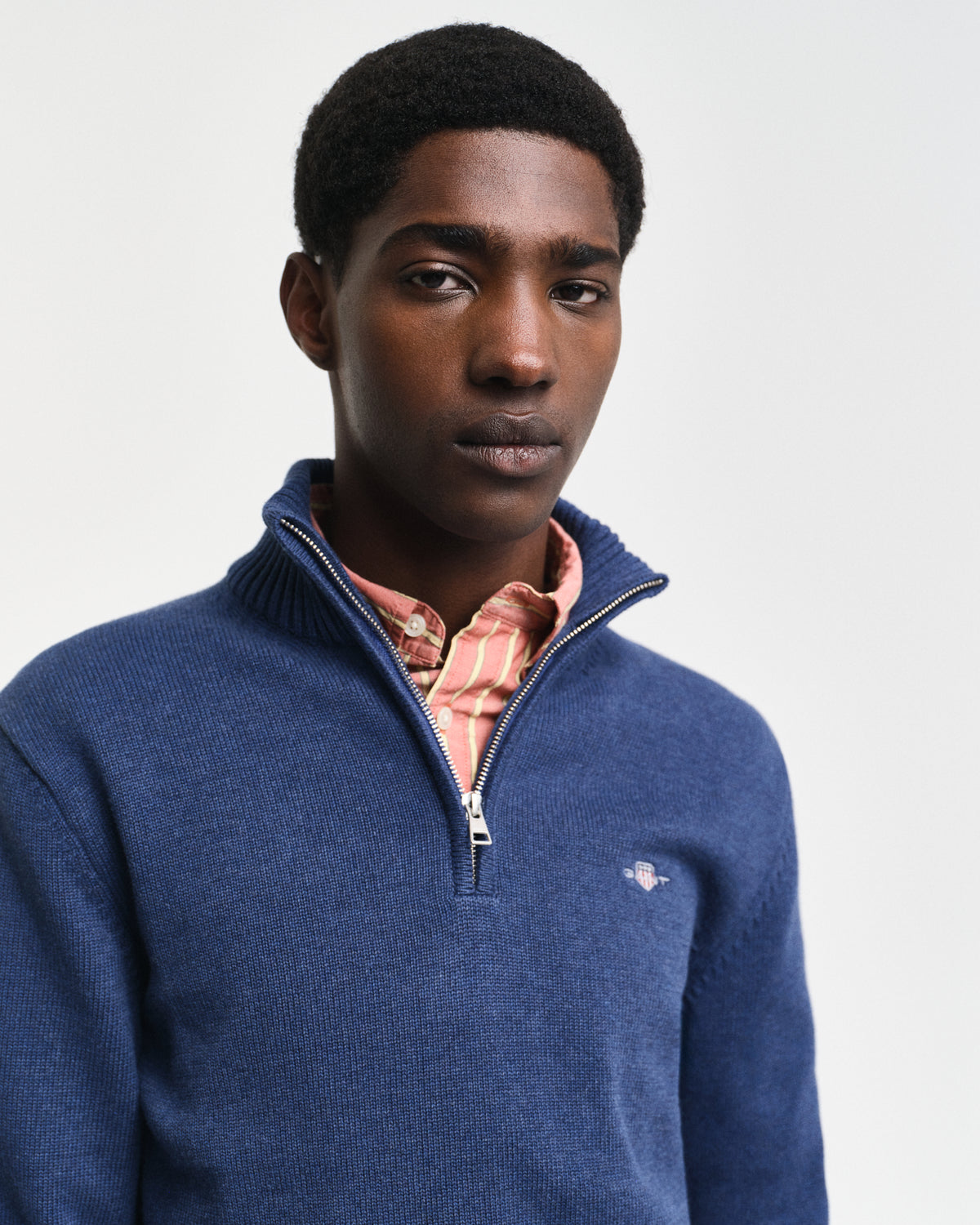 Crafted in medium-weight cotton and cut in a regular fit, this half-zip sweater features a GANT shield graphic embroidered at the chest. A perfect layer for style and warmth, pair this sweater with denim and tailored pants alike.