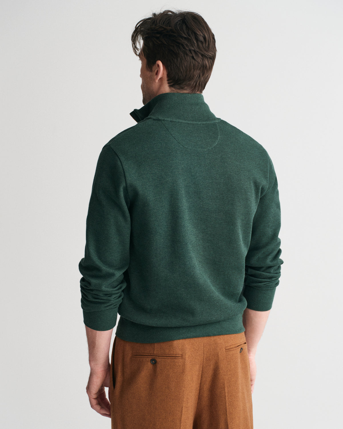 Dressier than a sweatshirt but just as comfortable, this piece is perfect for layering over shirts at the office or over T-shirts on the weekend.