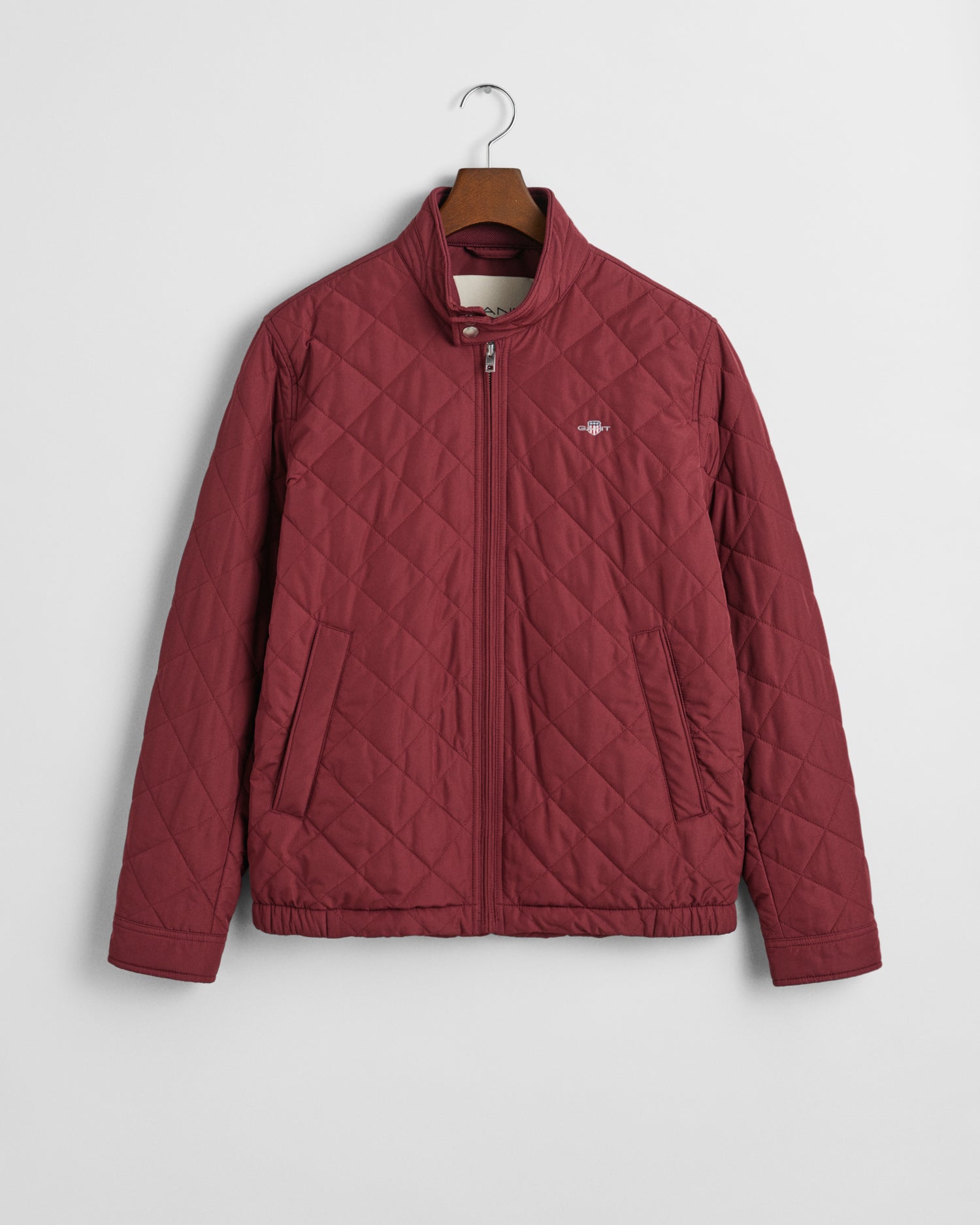 Crafted in a diamond quilting structure, this Quilted Windcheater Jacket features recycled polyester padding and is treated with a water-repellent finish. Design details include a one-way zipper at the front, snap buttons at the collar, slanted welt side pockets and an elasticated hem and cuff with a press button adjuster.