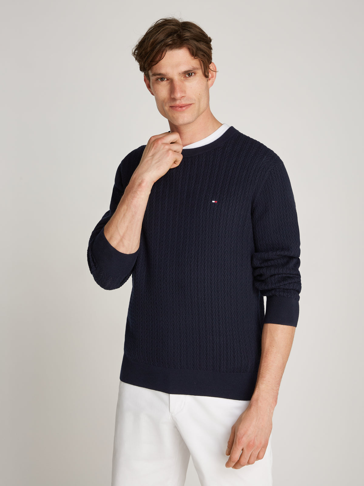 Tommy Hilfiger Herringbone Structure Crew Neck Jumper. Crafted from soft, premium fabric, this jumper features a sophisticated herringbone pattern that adds texture and depth to any casual or smart-casual outfit.