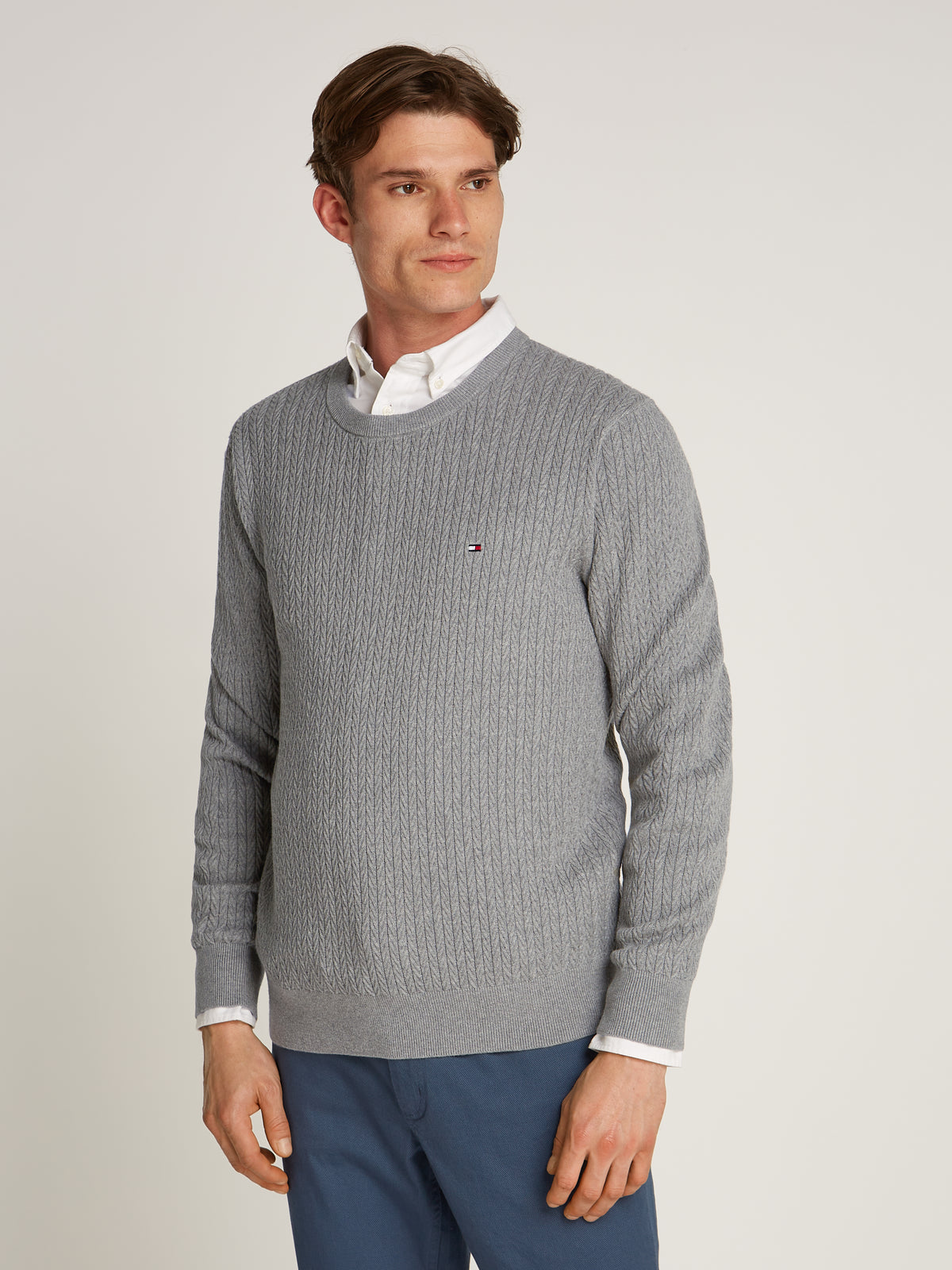 Tommy Hilfiger Herringbone Structure Crew Neck Jumper. Crafted from soft, premium fabric, this jumper features a sophisticated herringbone pattern that adds texture and depth to any casual or smart-casual outfit.