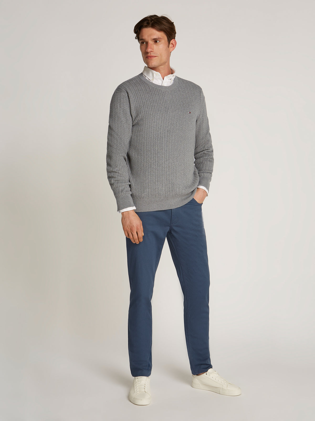 Tommy Hilfiger Herringbone Structure Crew Neck Jumper. Crafted from soft, premium fabric, this jumper features a sophisticated herringbone pattern that adds texture and depth to any casual or smart-casual outfit.