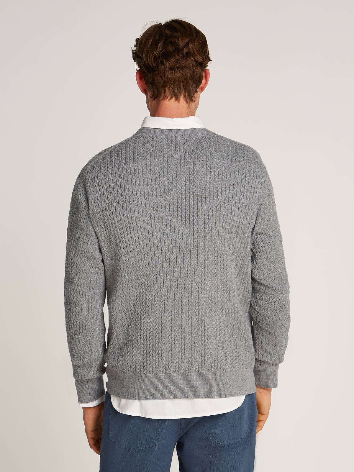 Tommy Hilfiger Herringbone Structure Crew Neck Jumper. Crafted from soft, premium fabric, this jumper features a sophisticated herringbone pattern that adds texture and depth to any casual or smart-casual outfit.