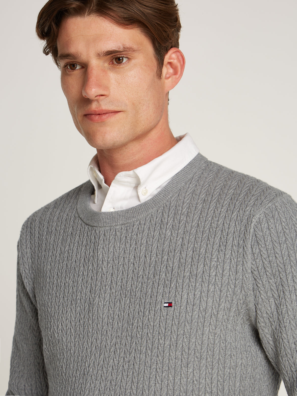 Tommy Hilfiger Herringbone Structure Crew Neck Jumper. Crafted from soft, premium fabric, this jumper features a sophisticated herringbone pattern that adds texture and depth to any casual or smart-casual outfit.