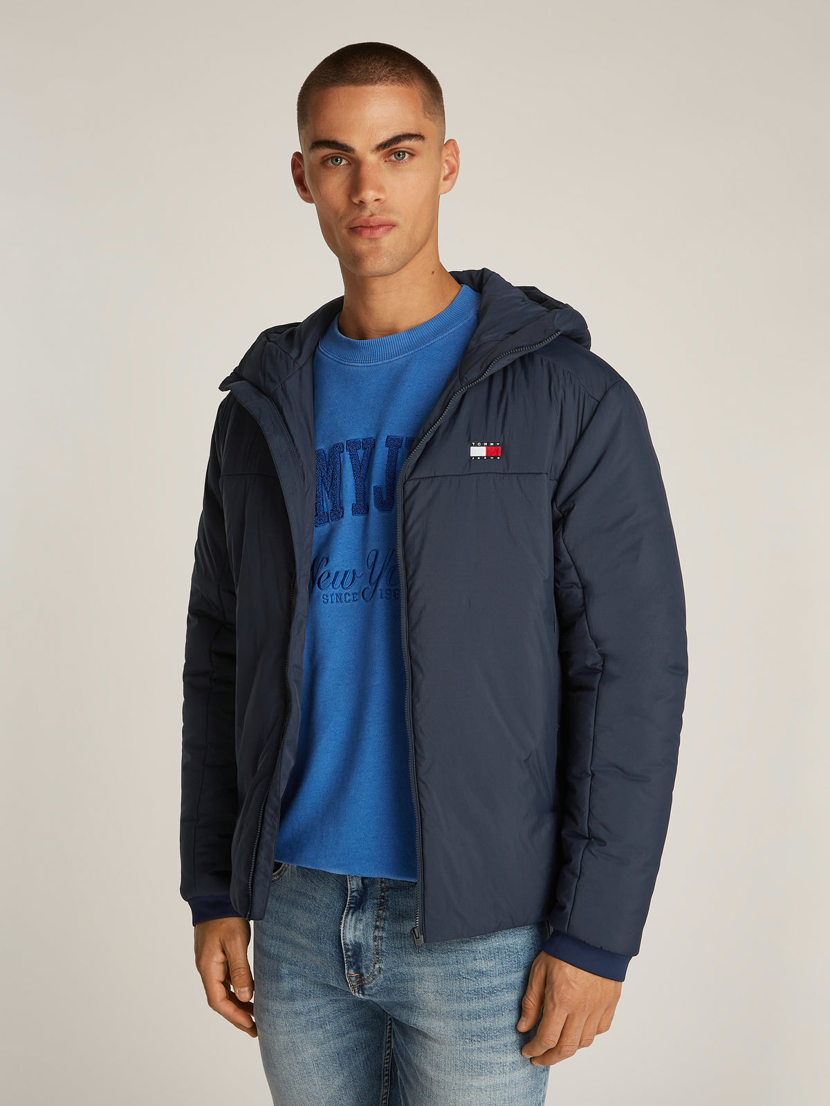 Tommy Jeans TJM LT Poly Jacket is a stylish and functional outerwear piece designed for versatility. Crafted from lightweight, durable poly material, this jacket offers comfort and weather resistance, making it ideal for transitional seasons.