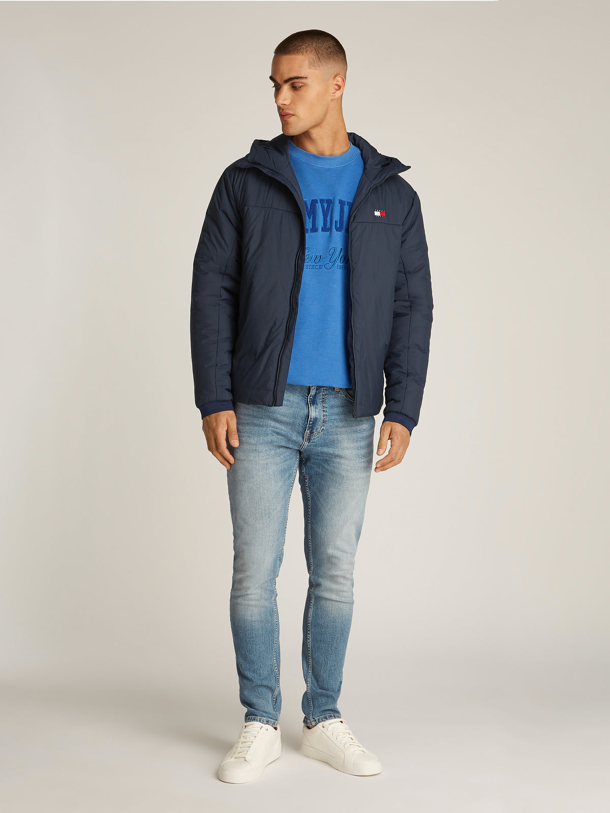 Tommy Jeans TJM LT Poly Jacket is a stylish and functional outerwear piece designed for versatility. Crafted from lightweight, durable poly material, this jacket offers comfort and weather resistance, making it ideal for transitional seasons.