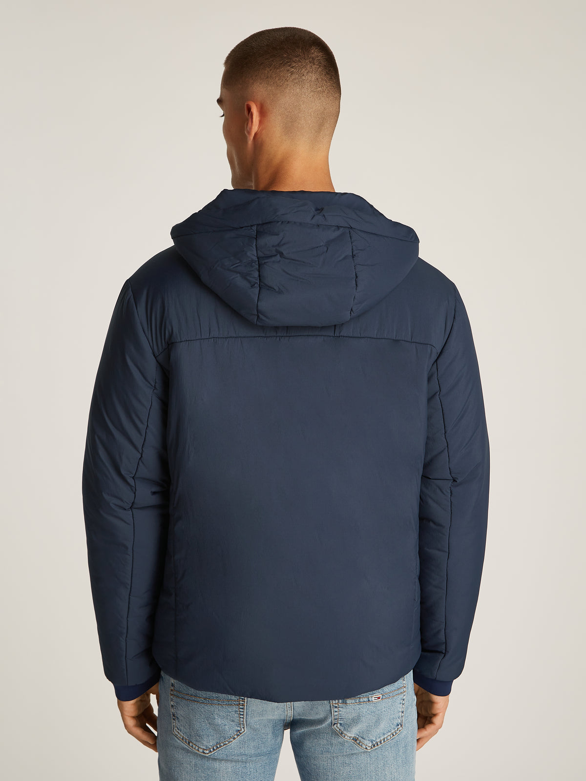 Tommy Jeans TJM LT Poly Jacket is a stylish and functional outerwear piece designed for versatility. Crafted from lightweight, durable poly material, this jacket offers comfort and weather resistance, making it ideal for transitional seasons.