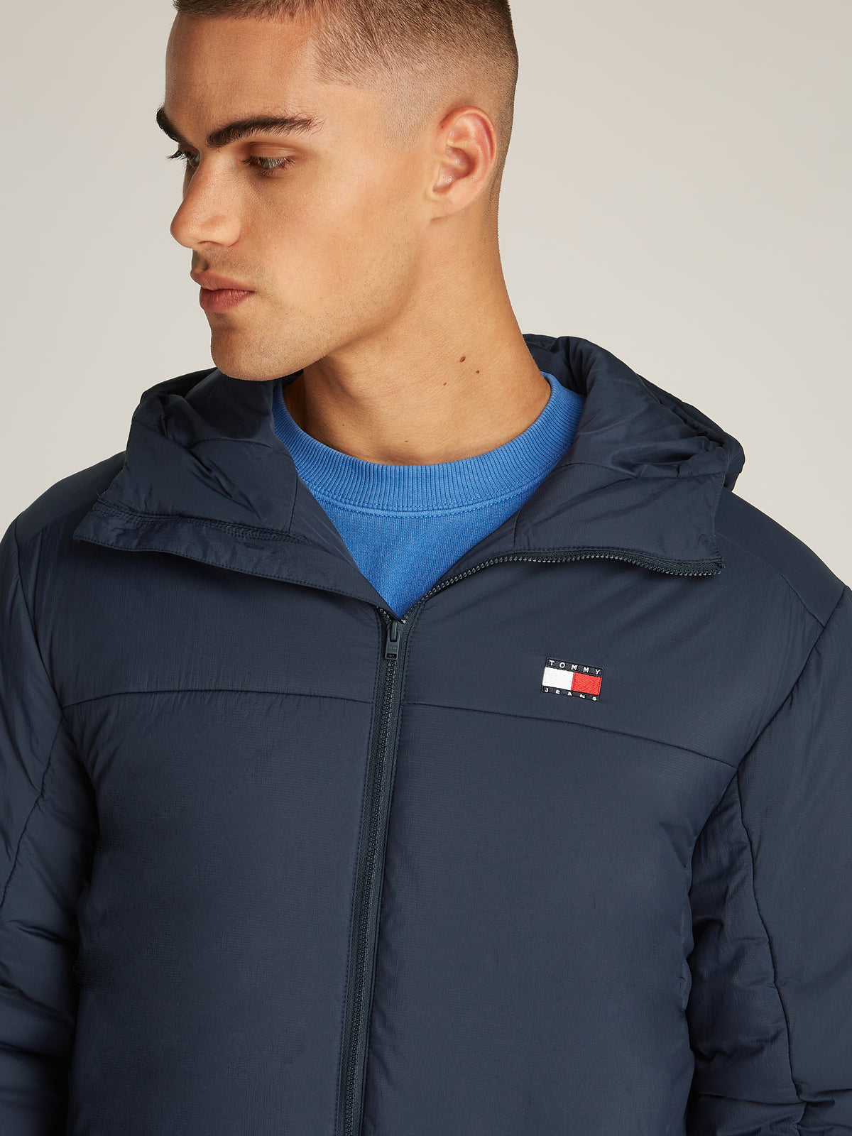 Tommy Jeans TJM LT Poly Jacket is a stylish and functional outerwear piece designed for versatility. Crafted from lightweight, durable poly material, this jacket offers comfort and weather resistance, making it ideal for transitional seasons.