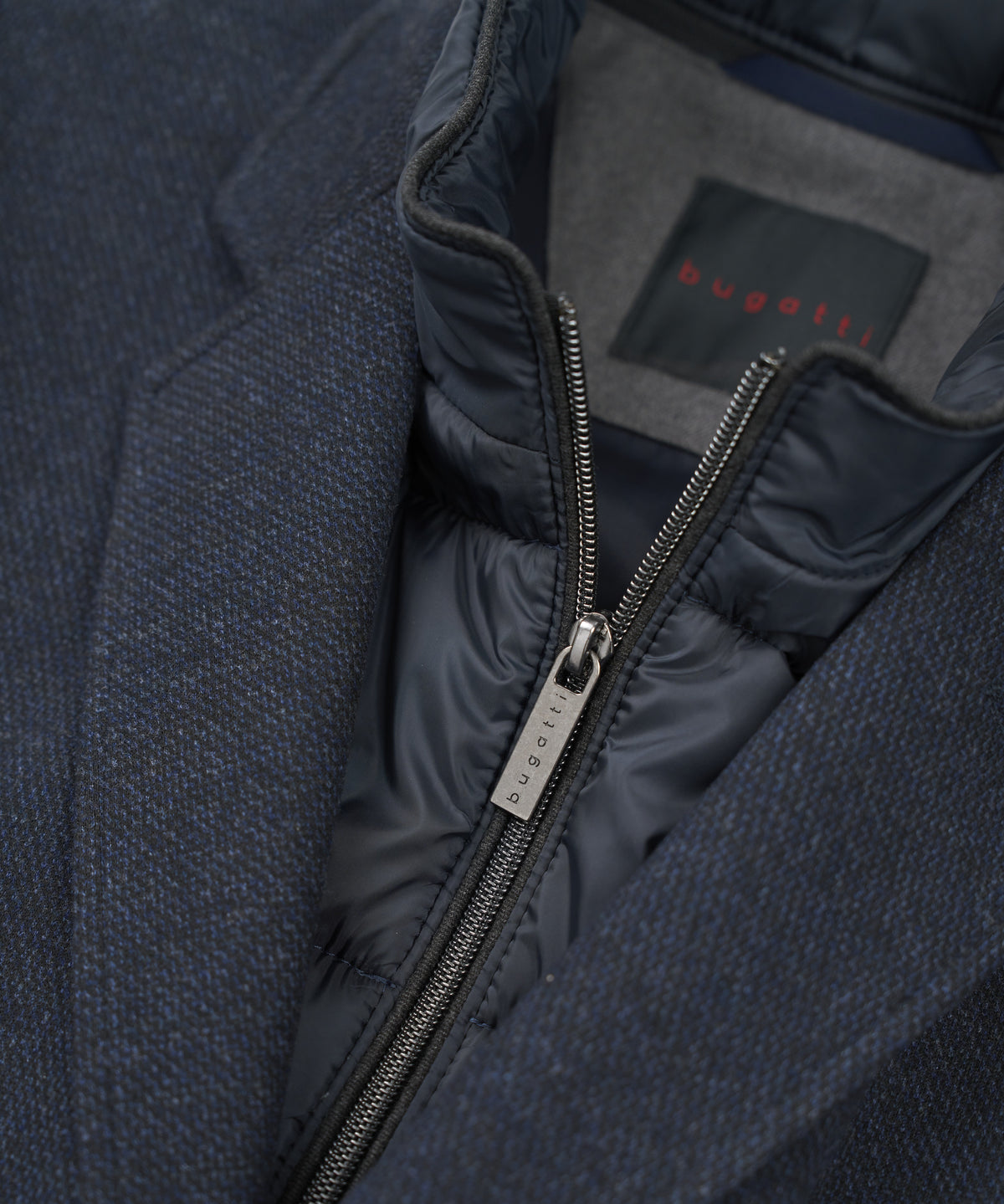 Bugatti Wool Overcoat is a luxurious blend of warmth and sophistication, perfect for elevating your outerwear collection. Constructed from premium wool, this overcoat provides comfort and insulation