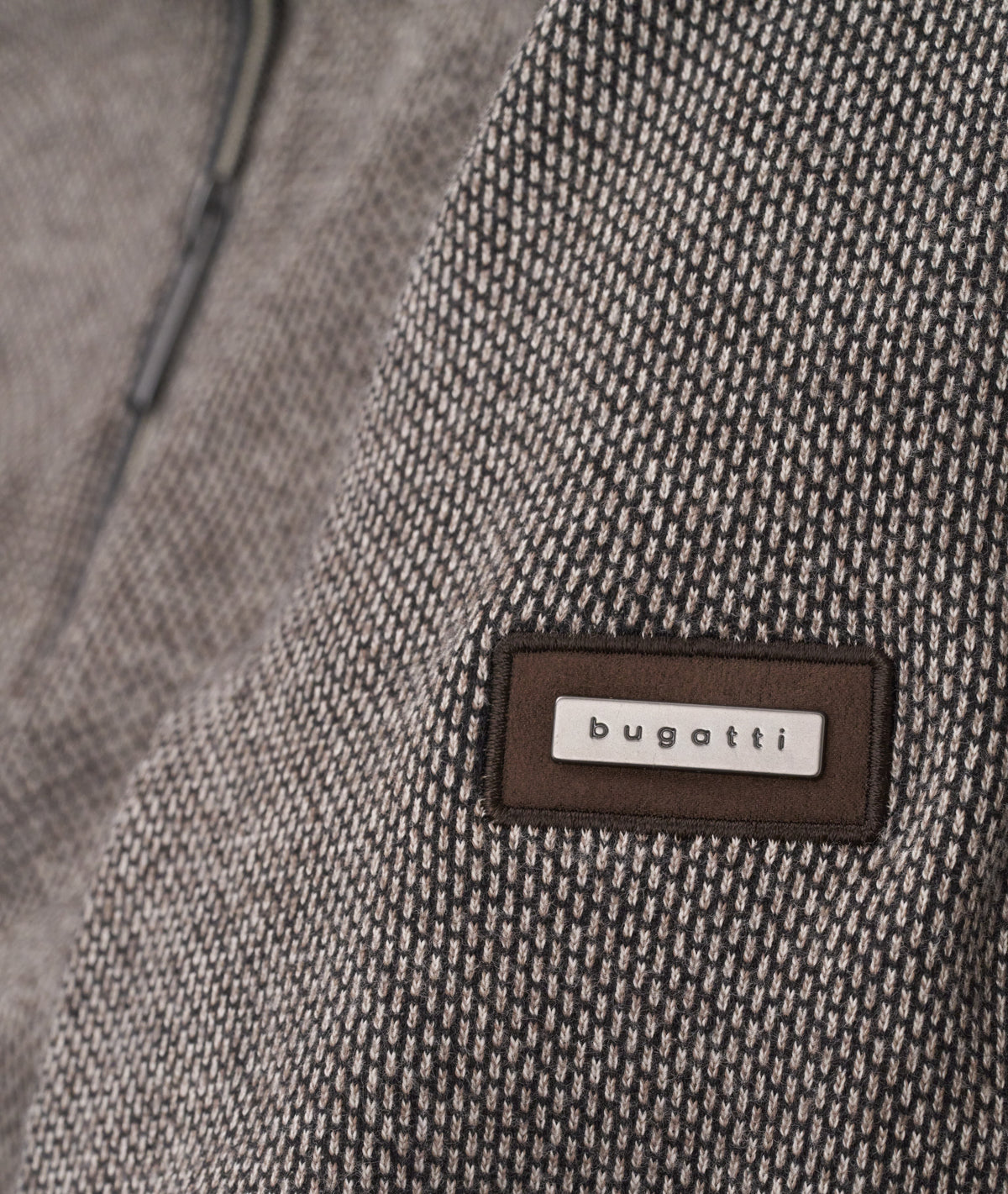 Bugatti 1/4 Zip with Pin Dot Long Sleeve Top offers a refined blend of casual comfort and stylish detailing. Featuring a subtle pin dot pattern, this top brings a modern twist to a classic design. The 1/4 zip closure allows for adjustable ventilation