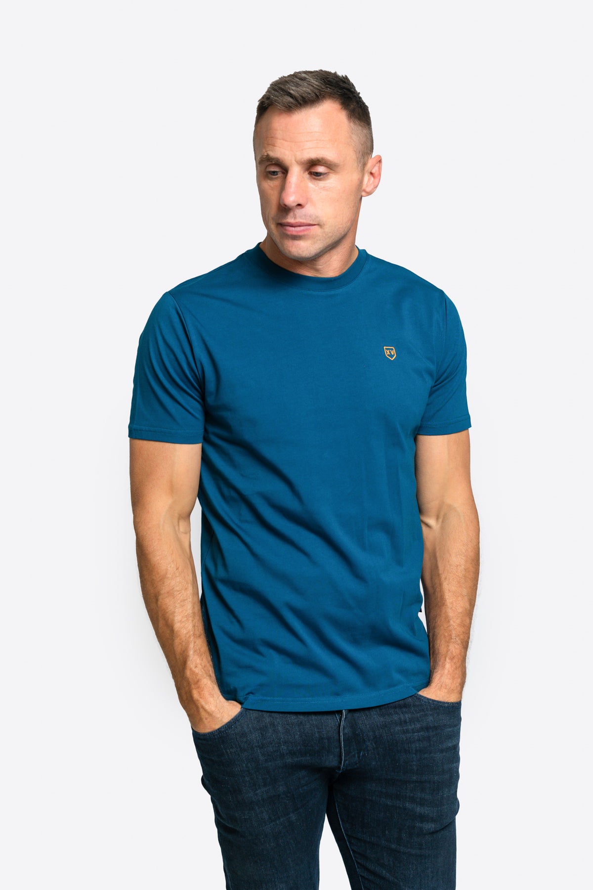  XV Kings Golden Eagles Tee is a stylish and comfortable staple, perfect for casual wear. Crafted from premium fabric, this short sleeve crew neck t-shirt offers a soft and breathable feel, ideal for all-day comfort. Featuring modern branding and a sleek fit, this tee pairs effortlessly with jeans, chinos, or shorts, making it a versatile addition to your wardrobe.